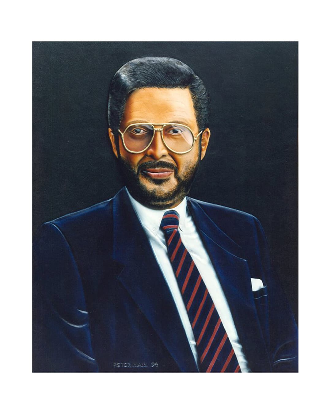 A carved leather portrait of Rene Rivkin, bearded, in a dark suit and striped tie, against a black ground.